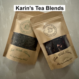 Two open brown paper bags of tea with visible tea leaves, branded 'Karin's Tea Blends'.