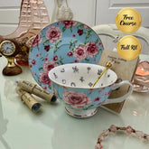 Blue pink rose floral tea leaf reading cup set with gold crystal teaspoon, loose-leaf tea tube samplers and saucer, displayed with Fortune Telling Teacup card
