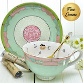 Tea cup and saucer with decorative elements on a white wooden surface