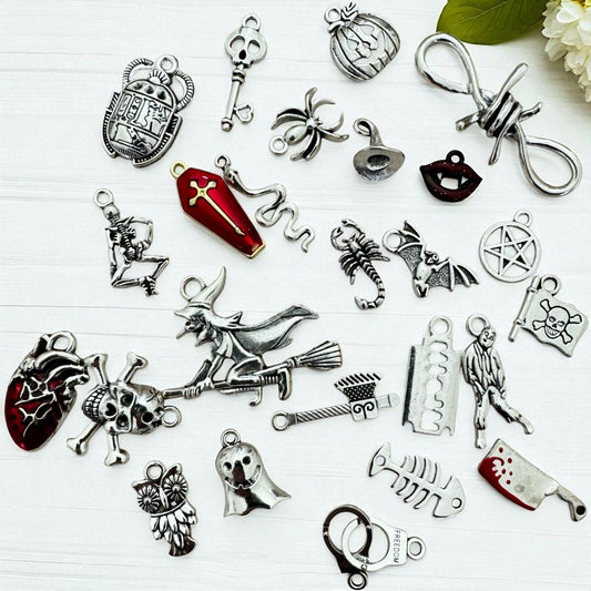 Halloween Charm Casting Set with 26 charms including skull, black cat, spider and coffin symbols