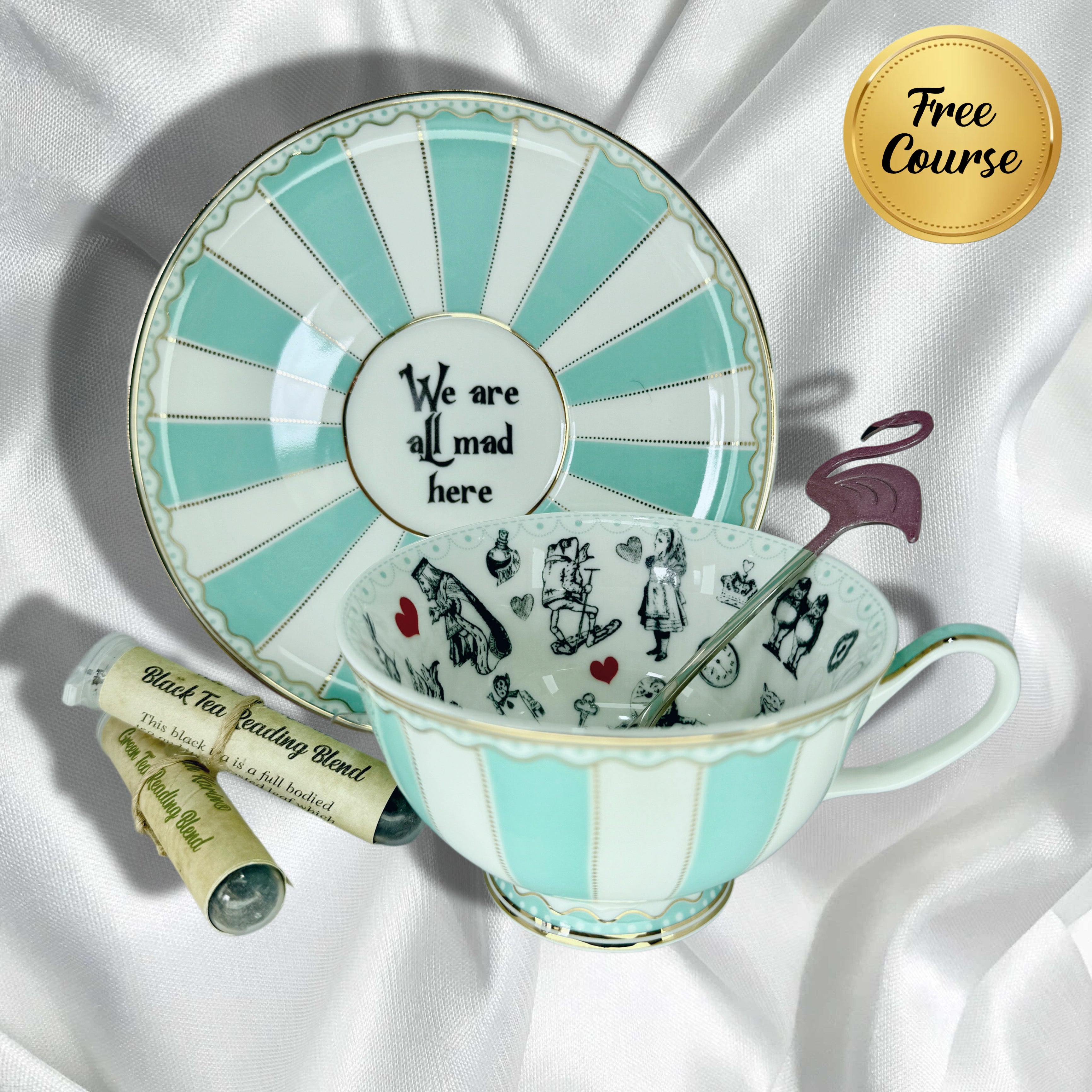 Turquoise and white striped teacup and saucer set with a flamingo teaspoon and two sample tea tubes