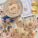 Curated Tea Alice in Wonderland kit with cards, dice, and tins on a patterned background
