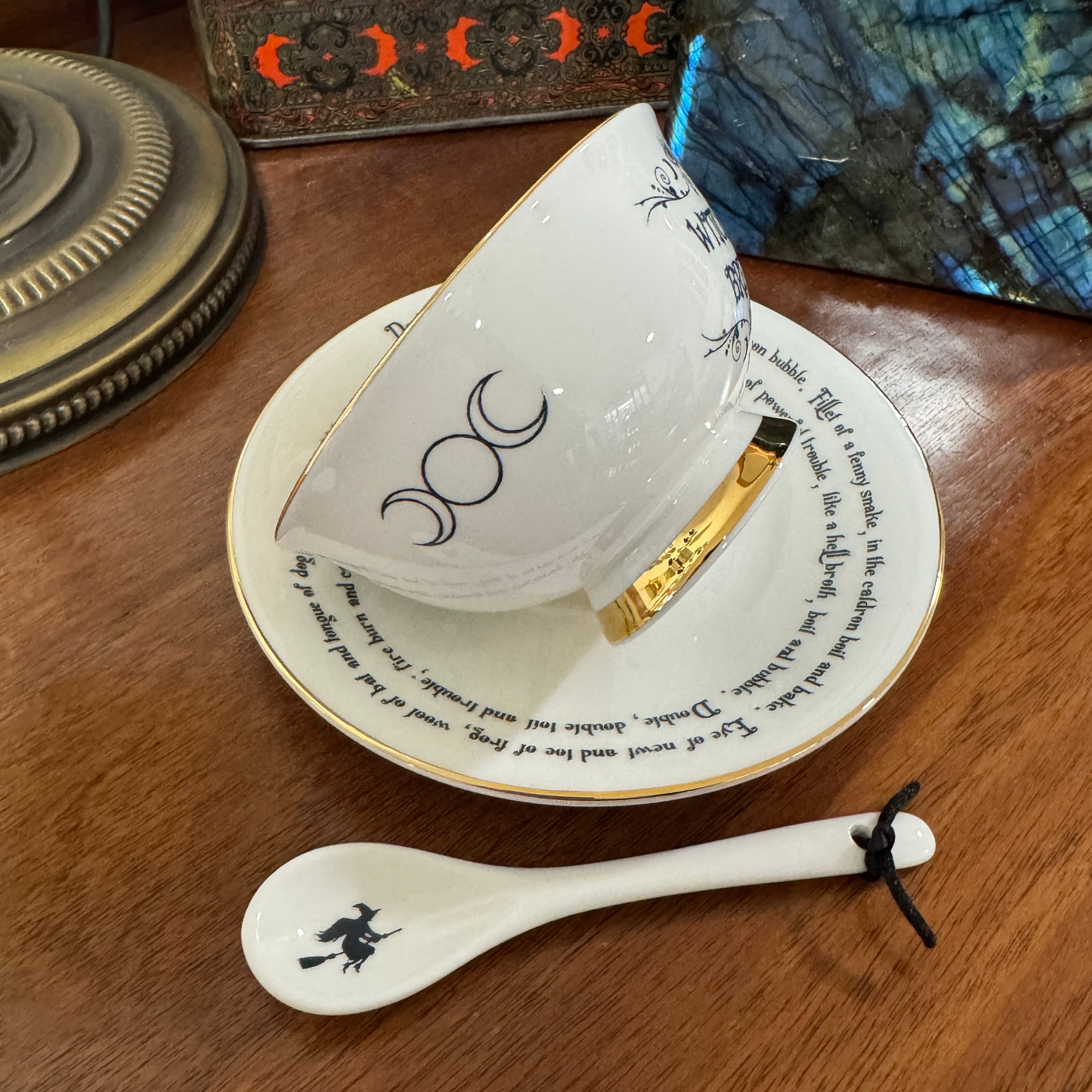 Witches Brew Tea Leaf Reading Teacup Set 227 – Lifestyle image of white fortune telling teacup with witches brew symbols for divination