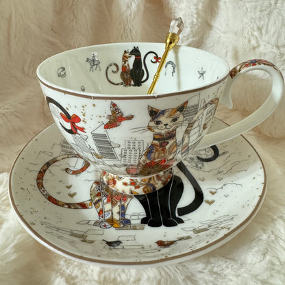 Unique teacup featuring a mystical cat fortune teller, surrounded by magical elements. Full tea leaf reading kit with free course. Perfect gift.