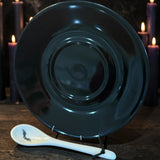 Matching jet black saucer from the Halloween tea leaf reading set