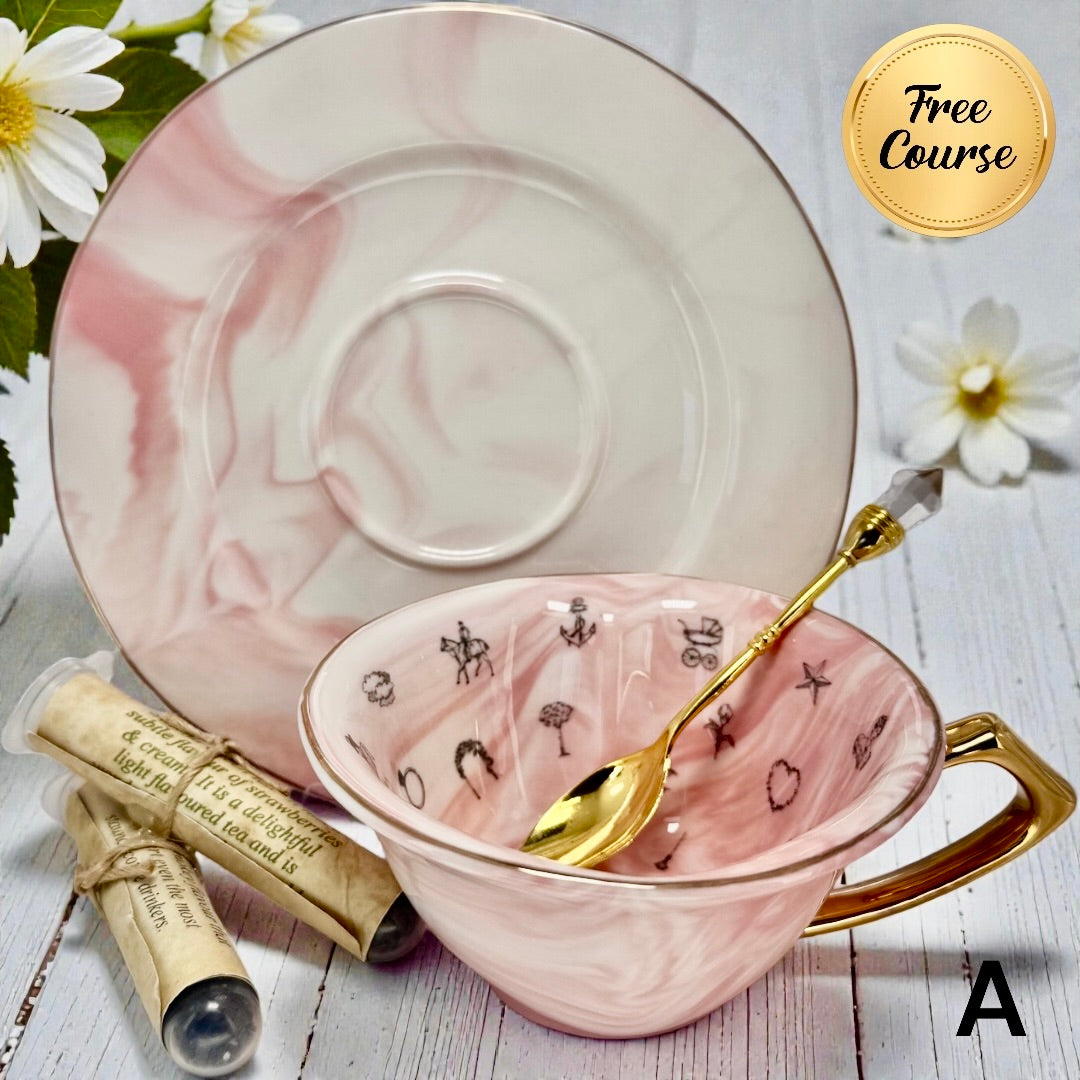 Pink teacup with gold spoon and saucer on a wooden surface with flowers