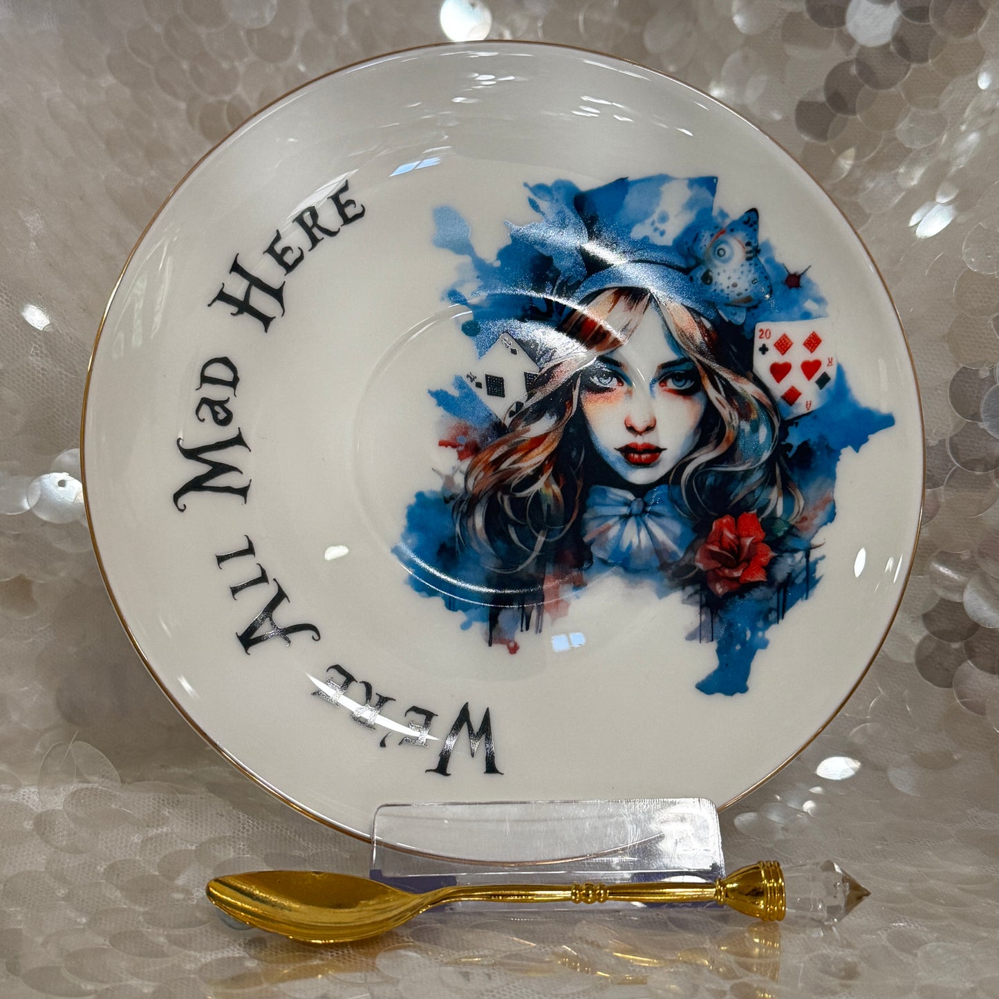 Alice in Wonderland Tea cup and saucer set. Punk style Alice. Learn tea leaf reading the easy way. FREE online course.