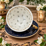 Internal view of the tea leaf reading symbols inside this beautiful teacup. This is a limited edition navy blue astrology teacup with real 24 karat gold zodiacs on both the teacup and the saucer.