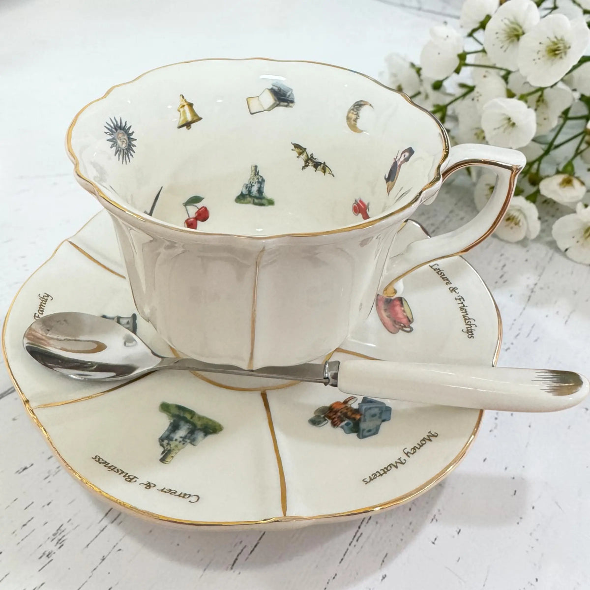 Labyrinth teacup and saucer with a steel spoon with a white porcelain handle