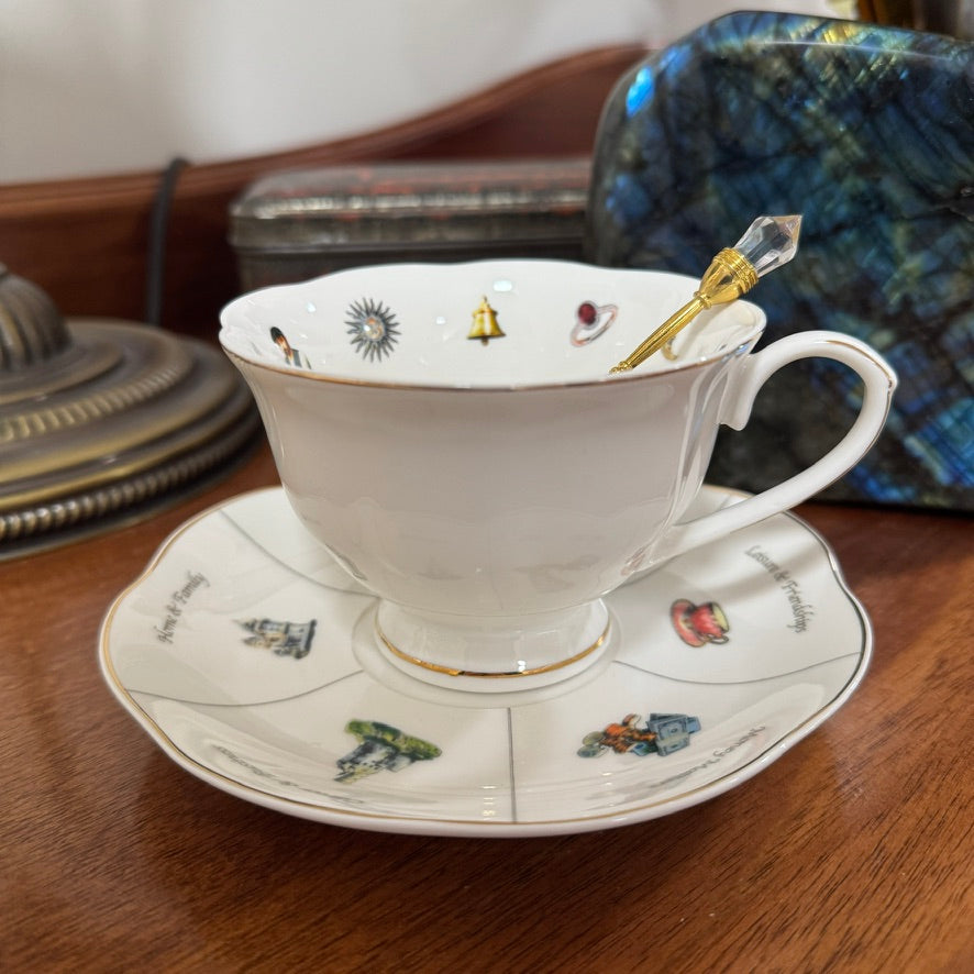 White teacup and saucer with decorative elements on a wooden surface