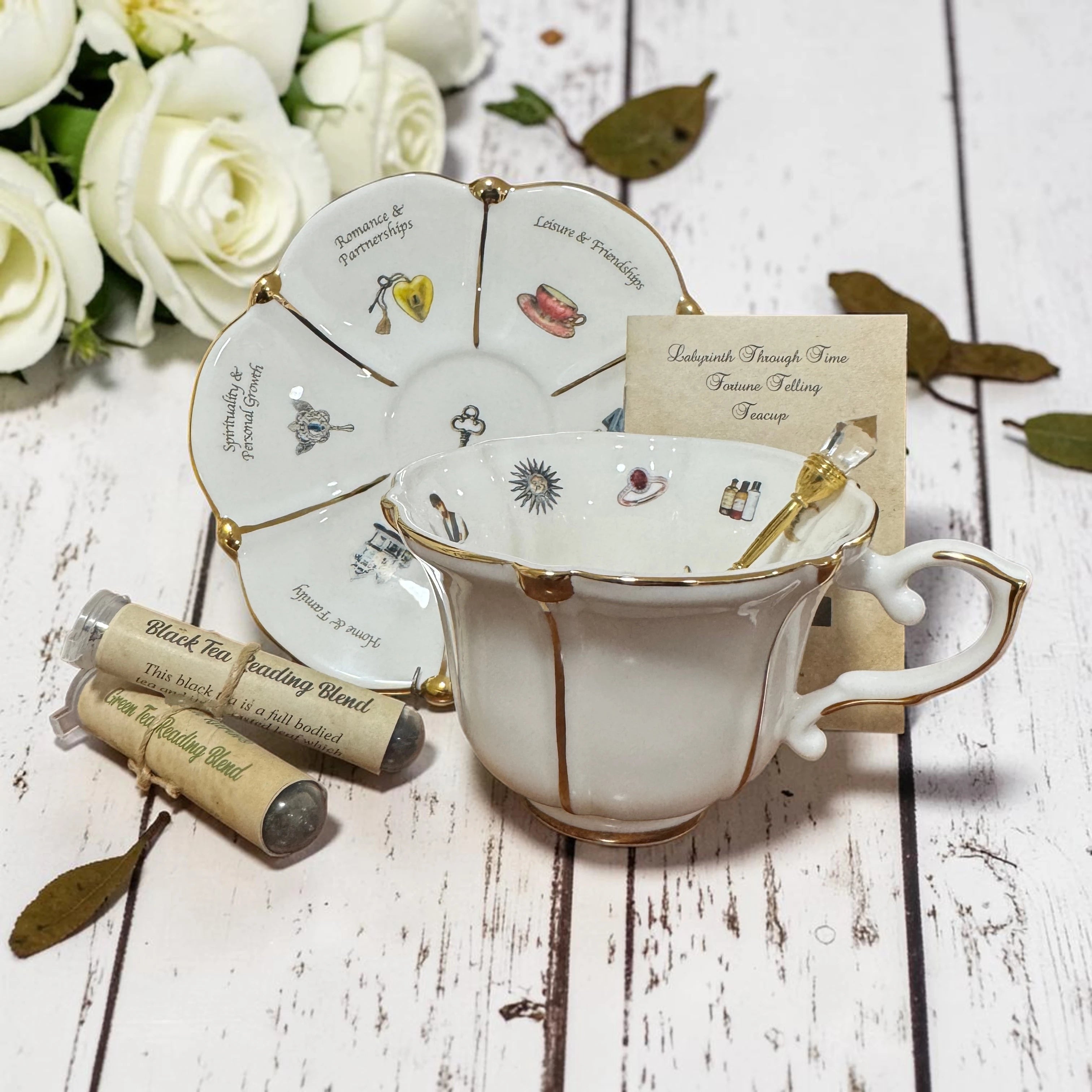 White teacup and saucer for the Labyrinth Through Time divination kit, shown alone.