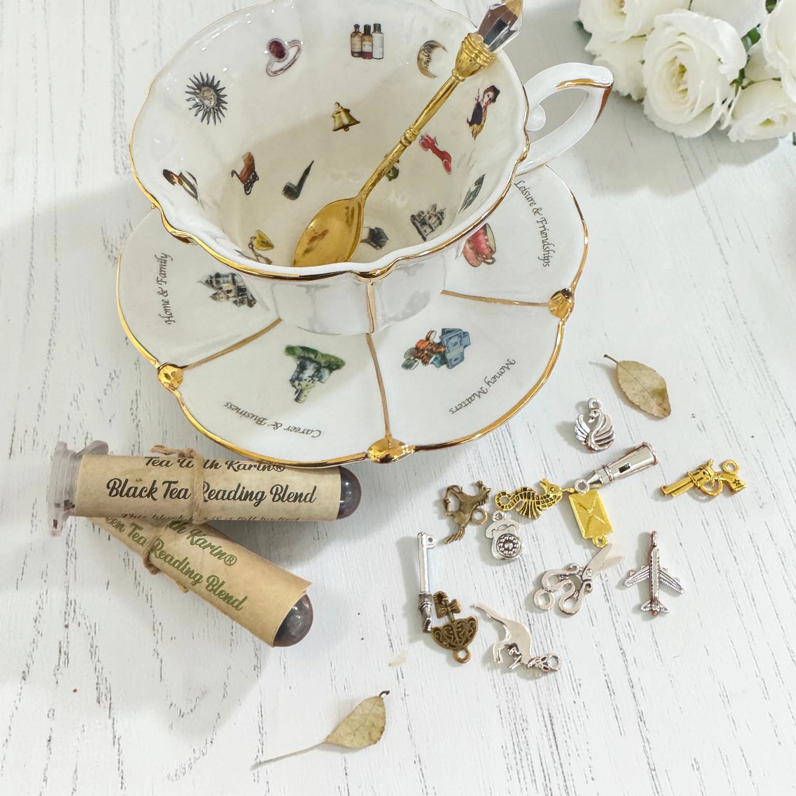 Labyrinth Through Time white teacup displayed with tea leaf reading charm set