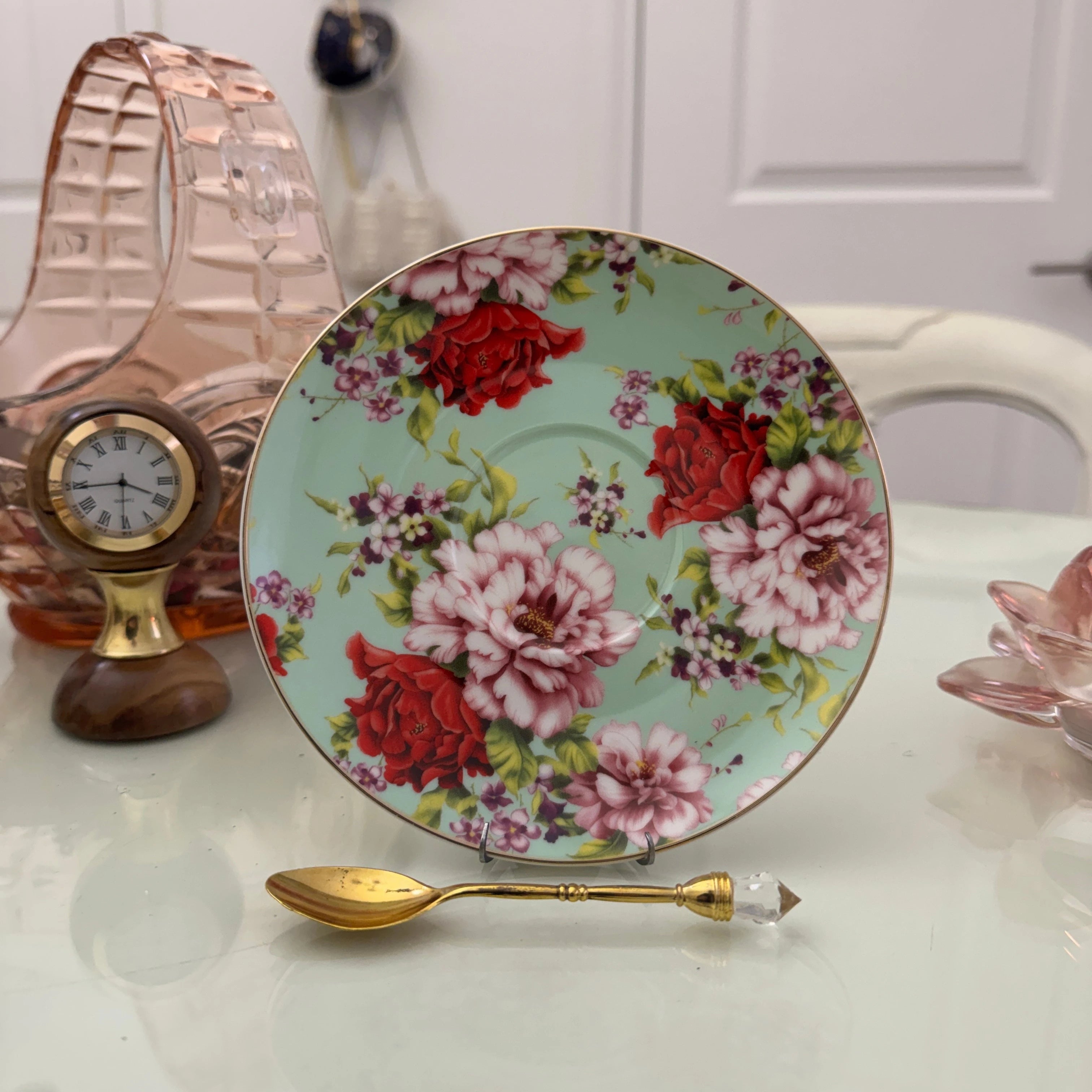 Mint red rose floral ceramic saucer with gold rim from tea leaf reading cup set, displayed with gold crystal teaspoon