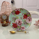Mint red rose floral ceramic saucer with gold rim from tea leaf reading cup set, displayed with gold crystal teaspoon