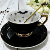 Black bat fortune telling teacup and saucer set with bat inside the teacup and also on the saucer. Bat teaspoon included.
