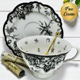 Elegant black and white embossed birds tea cup and saucer set with detailed bird motif