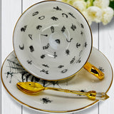 Close-up of web design across a white teacup, moody lighting