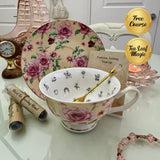 Pink butter rose floral tea leaf reading cup set with gold crystal teaspoon, loose-leaf tea tube samplers and saucer, displayed with Fortune Telling Teacup card
