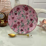 Pink rose floral ceramic saucer with gold rim from tea leaf reading cup set, displayed with gold crystal teaspoon