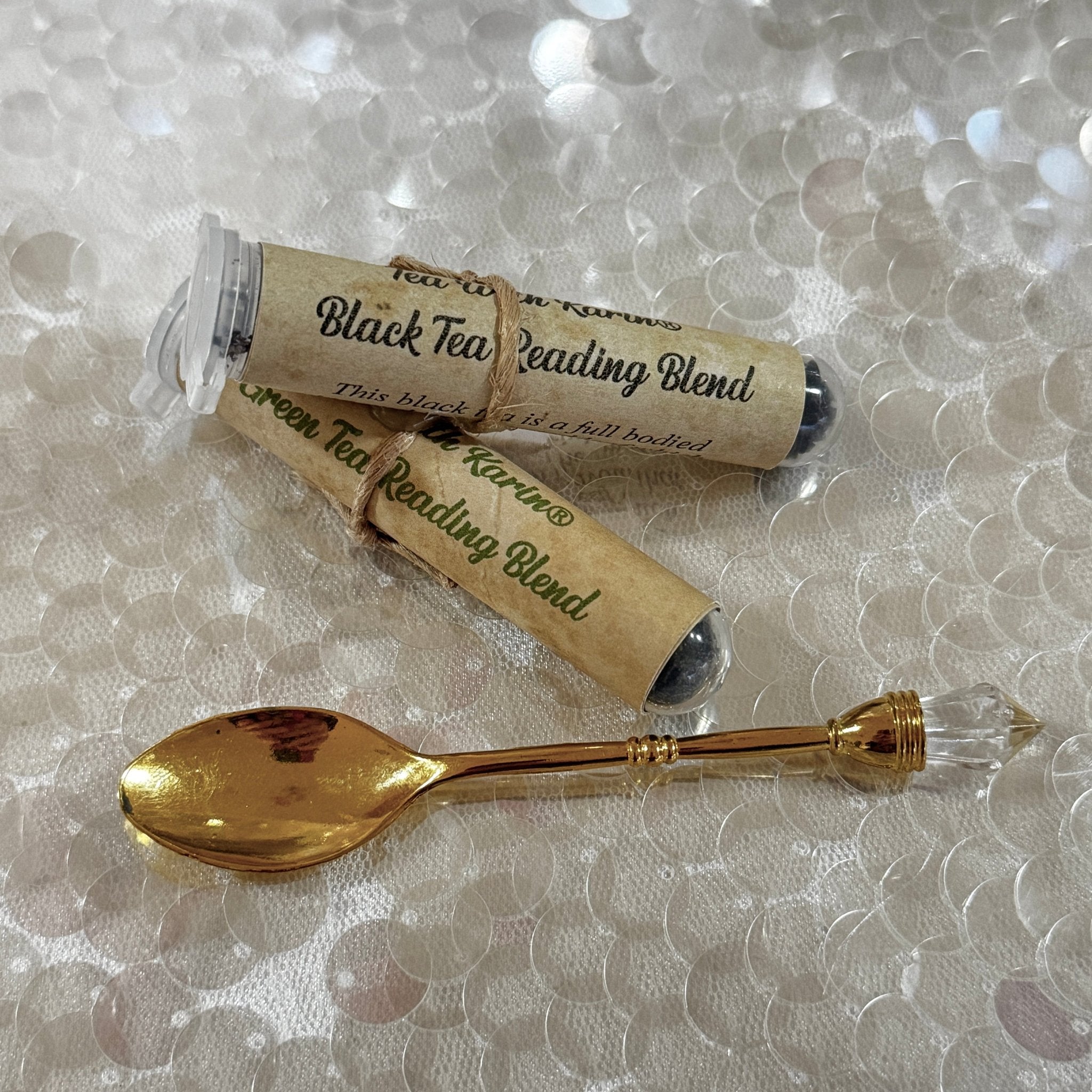 Gold teaspoon and tea samples. 