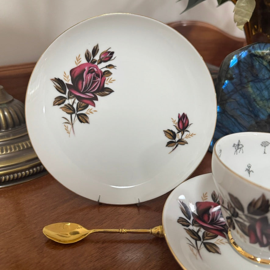 Decorative ceramic plate with floral design on a wooden surface