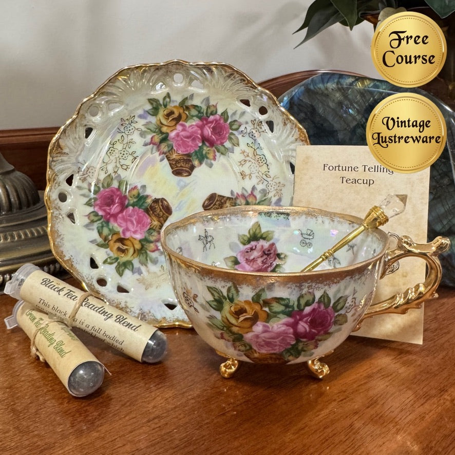 Decorative teacup with floral design on a wooden surface, next to a saucer and a card about vintage lustreware.