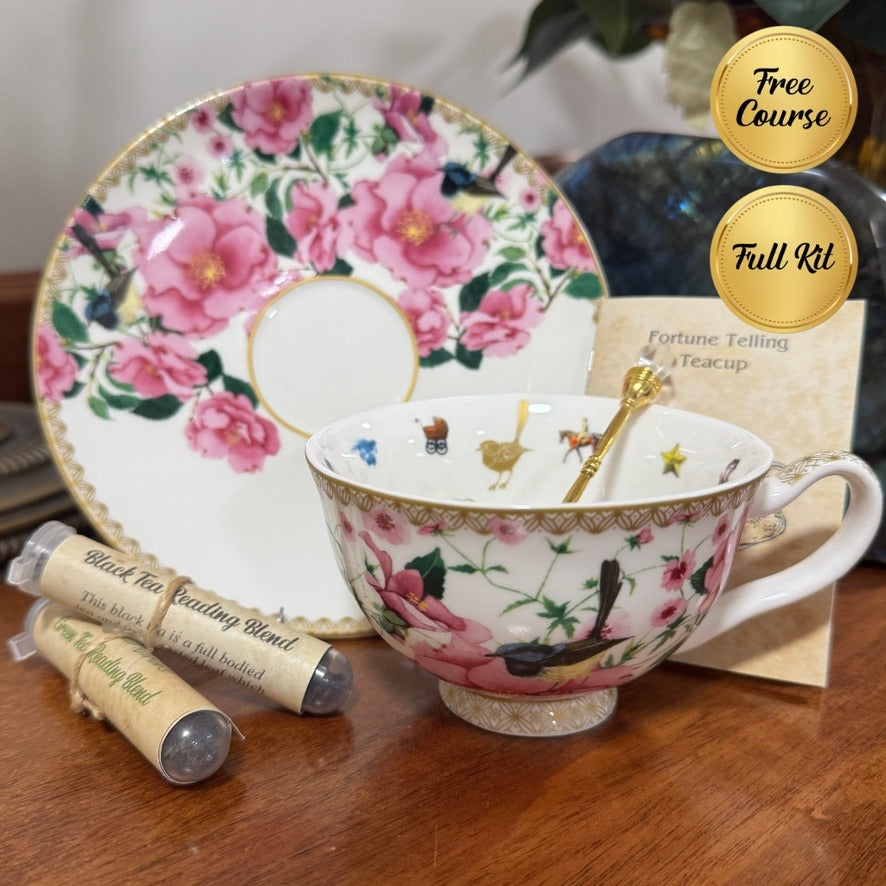 Floral teacup and saucer set with tea packaging on a wooden surface