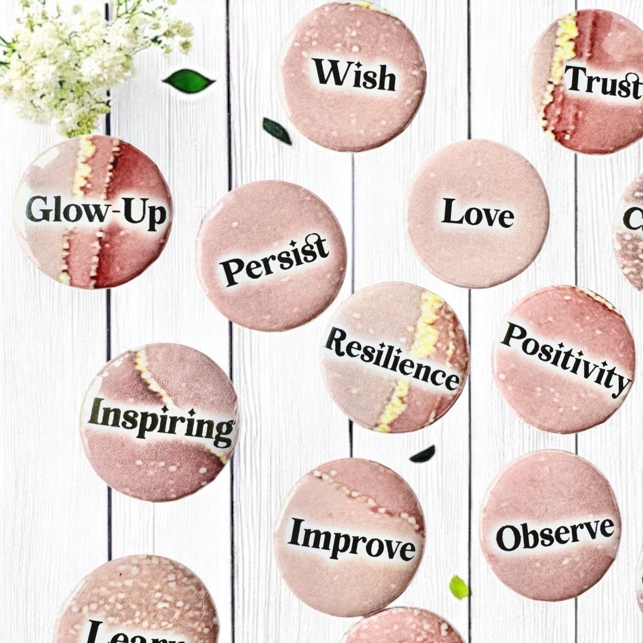 Set of 1-inch affirmation buttons with positive affirmations on a soft, pale pink background, protected by a clear plastic coating, ideal for charm casting, journaling, oracle card spreads, and daily inspiration.  