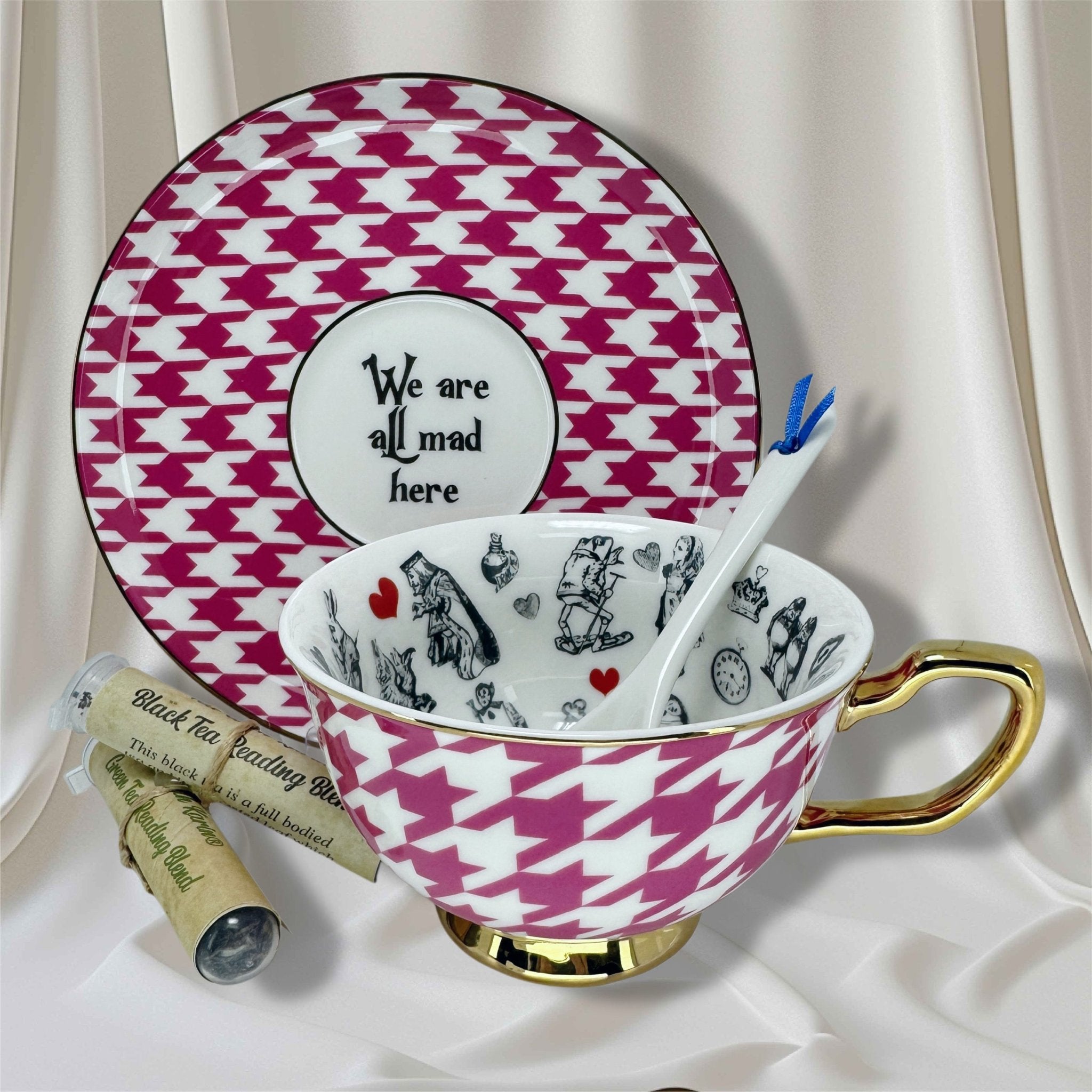 Teacup and saucer set with pink and white houndstooth pattern, featuring a quote and Alice in Wonderland design.