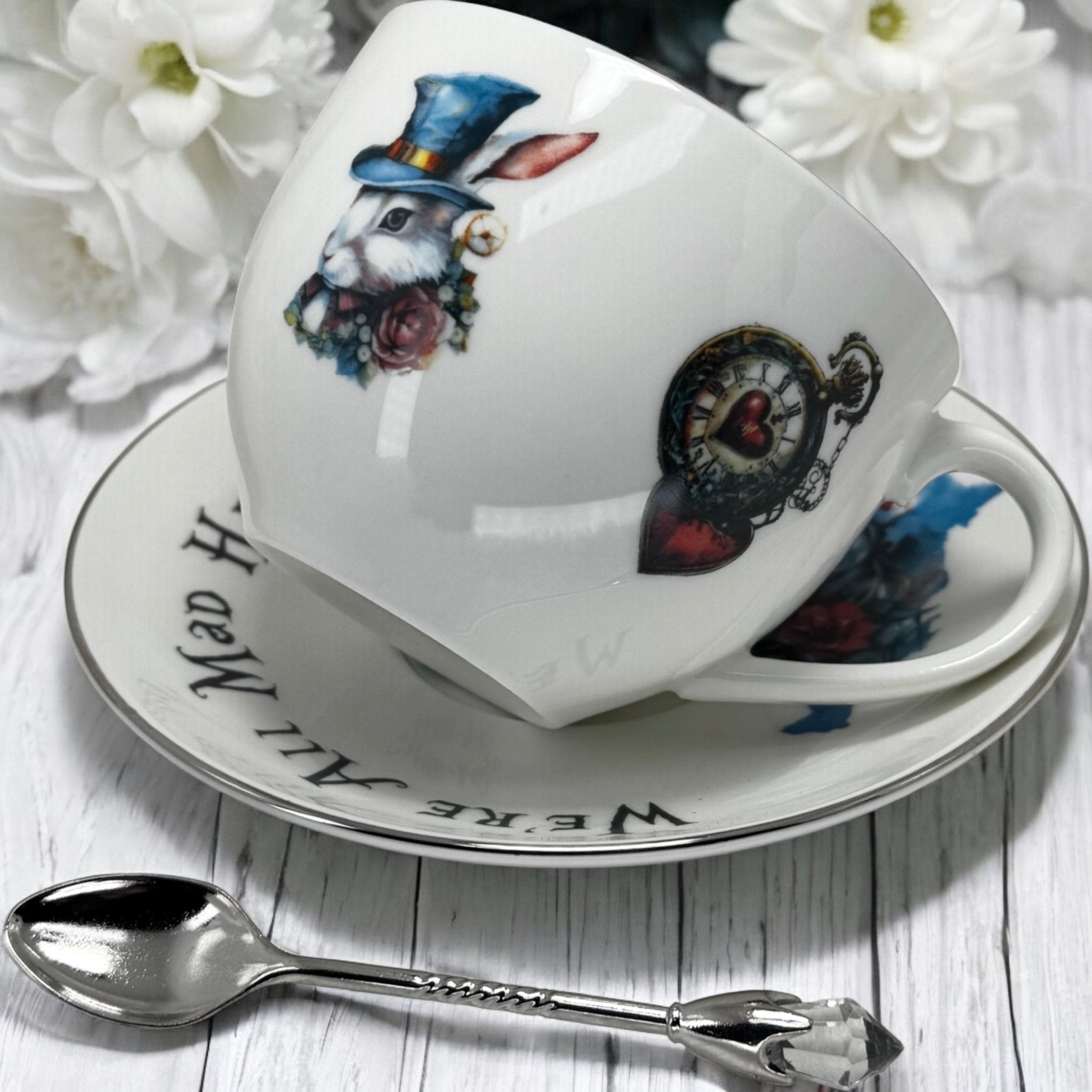 Decorative teacup with rabbit design on a saucer with floral background. Alice in Wonderland  for Fortune telling tea cup.