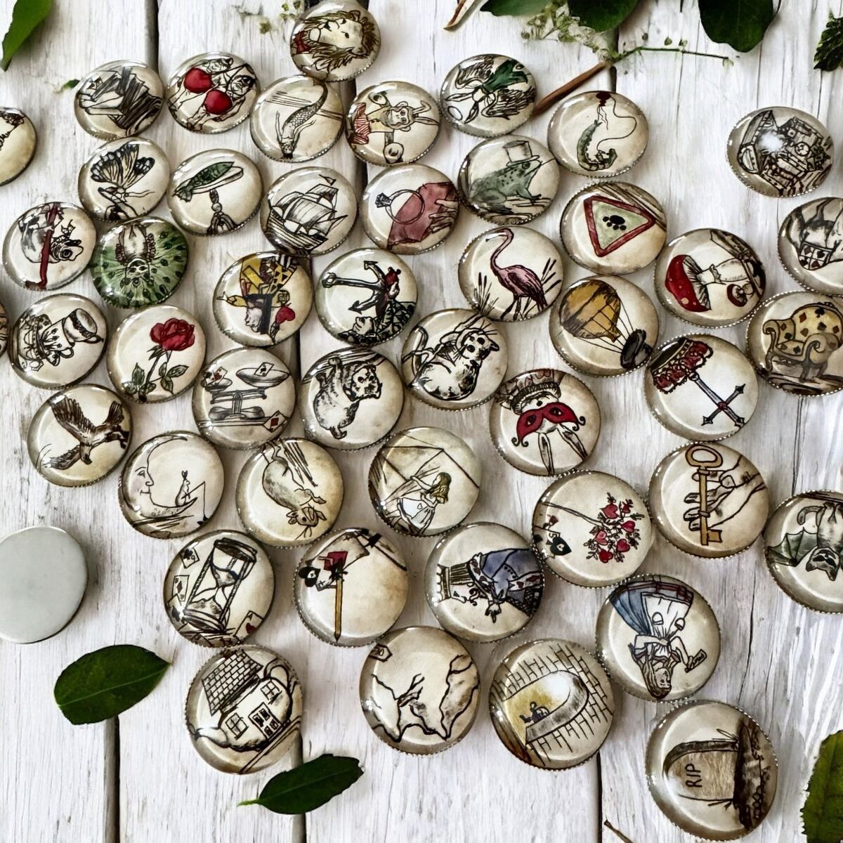 Reverse side of an Alice in Wonderland tea leaf reading coin