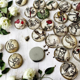 Close-up view of an Alice in Wonderland tea leaf reading coin
