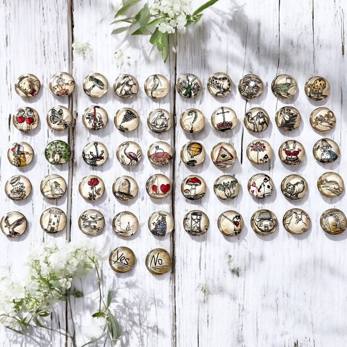 Alice in Wonderland tea leaf reading coins spread out on a flat surface