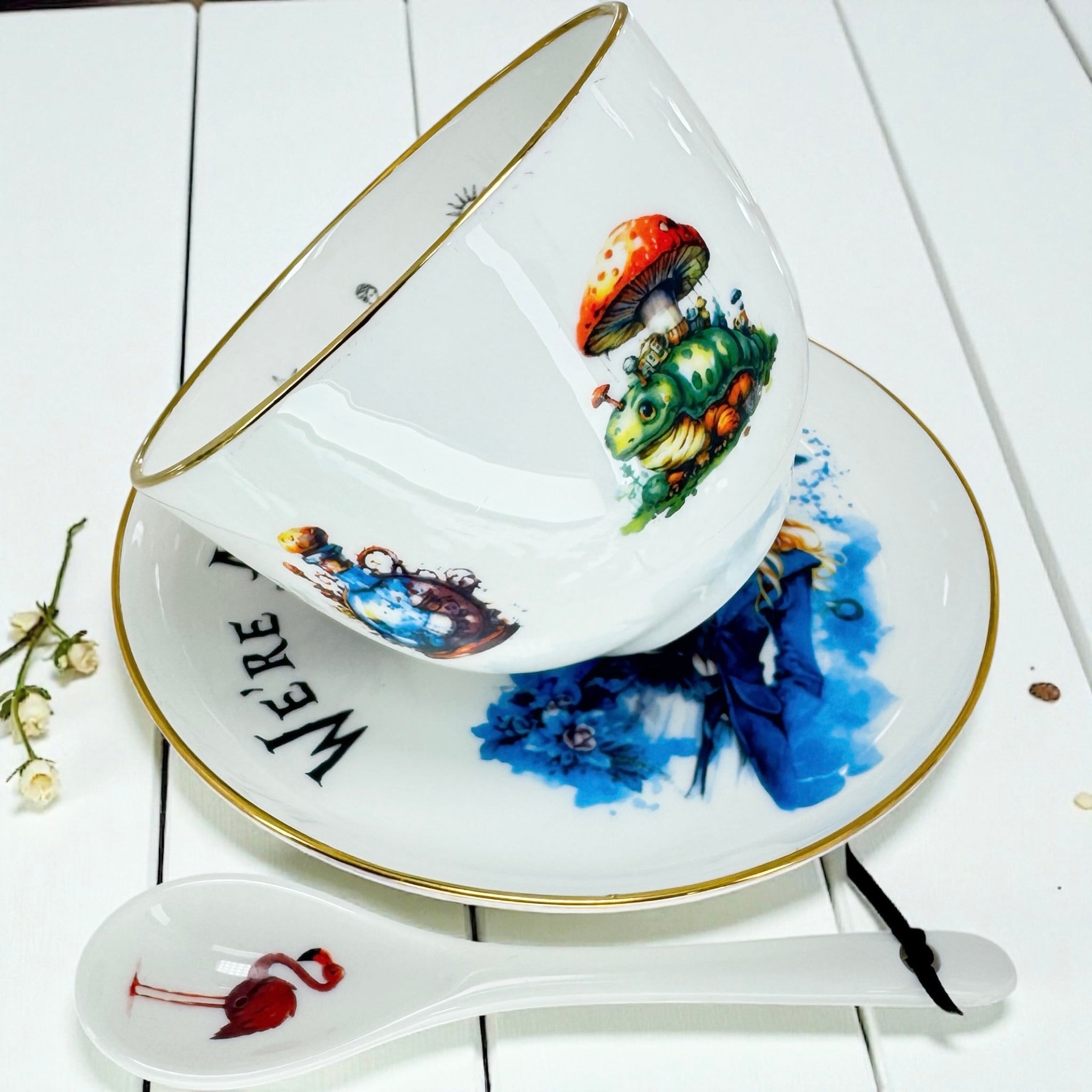 Alice in Wonderland Teacup set with a close-up of the Caterpillar on the Mushroom artwork, gold rim detail