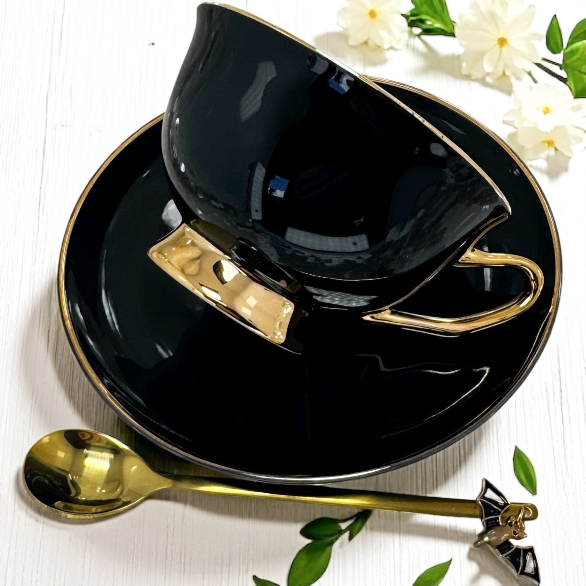 A gothic-themed tea ritual scene with the Death Moth Teacup, a black candle, and tarot cards, evoking a mystical, dark atmosphere for divination and self-discovery.