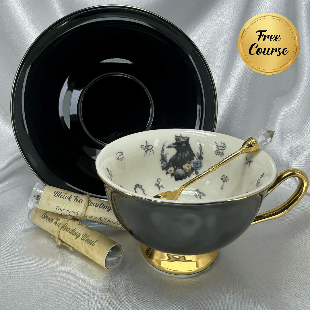 Teacup with gold handle and black saucer on a silver background