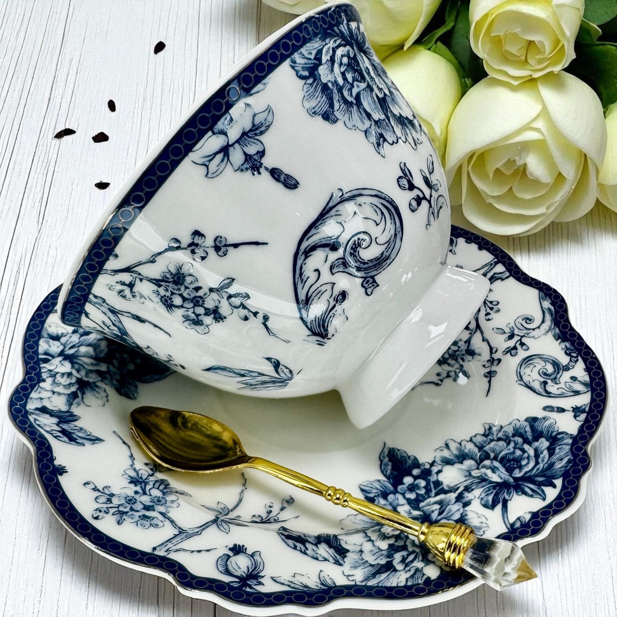 Full view of the blue bird tea set arranged on a table with natural lighting