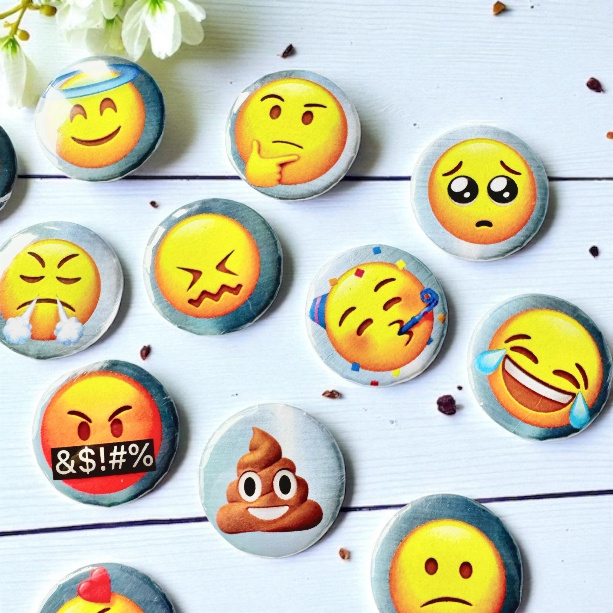 Detail of individual Emoji charm casting coins from Tea Leaf Reader Australia