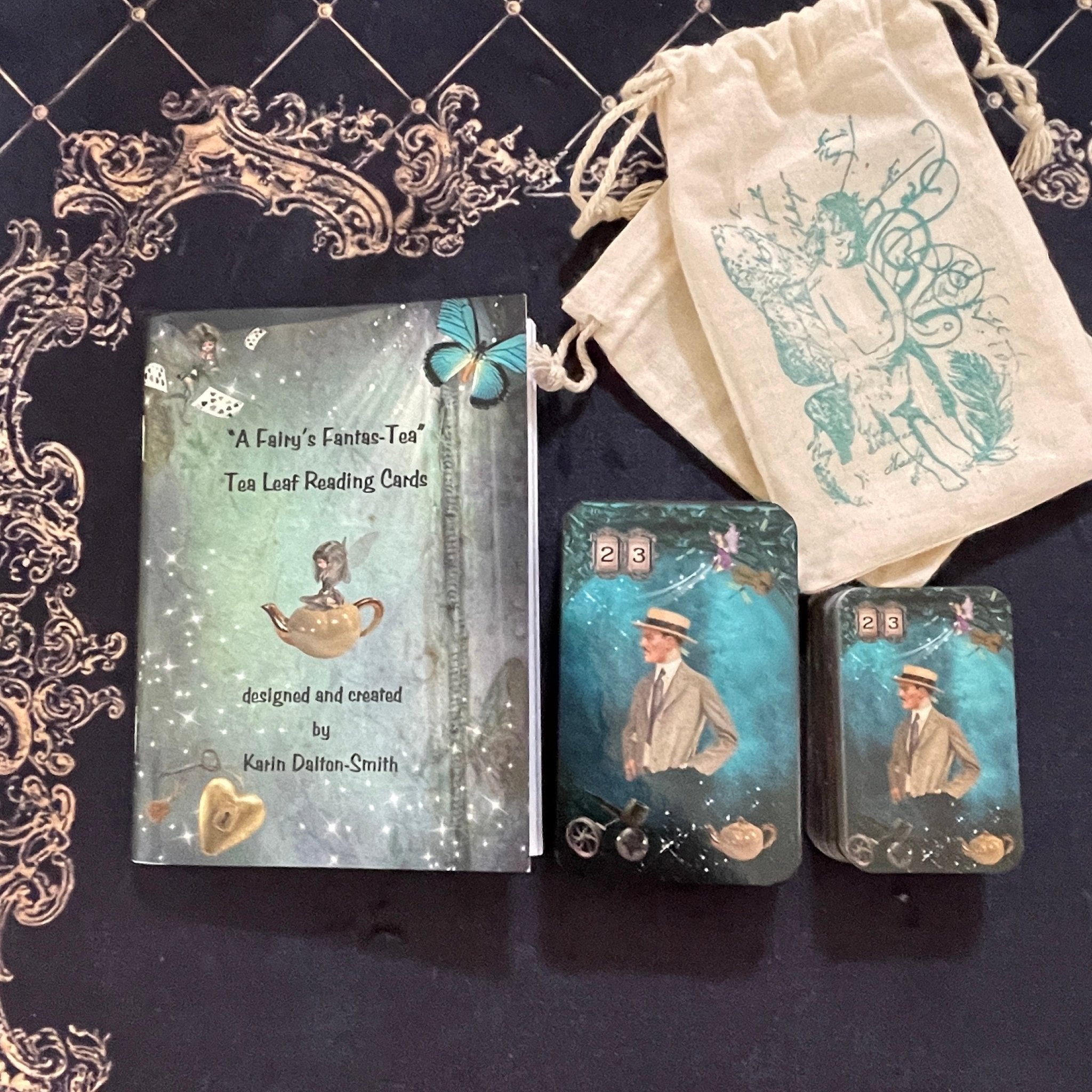 50-card tea leaf reading deck with high-gloss finish, diverse symbols including gender and relationship icons, accompanied by a booklet, cotton bag, symbol dictionary