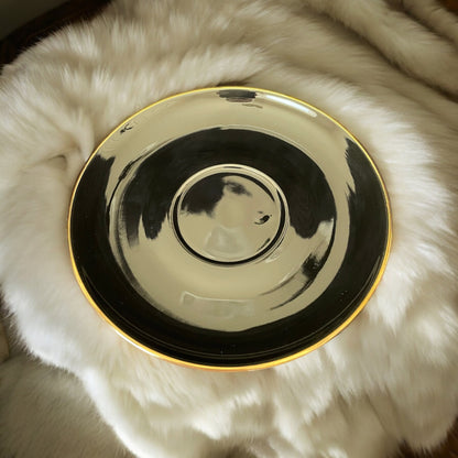 Black teacup with real 24kt gold trim on both the teacup and the saucer. Inside at the 22 major arcana tarot symbols for ease of tea leaf reading.
