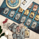 Magic & Mystery. This is a full divination system all in one travel kit tin.  It has washable spandex mat and 18 cards and 18 charms and 3 dice.