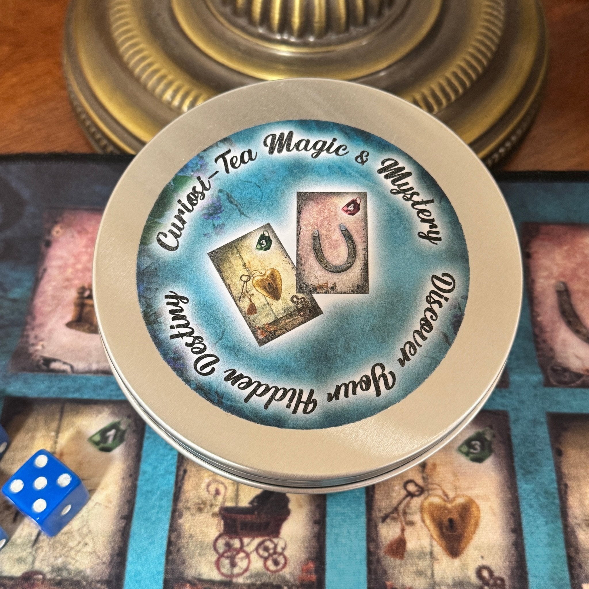 Curiosi-tea Magic and Mystery oracle kit gold tin with cards and charms laid out