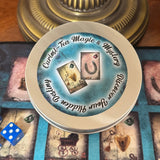 Curiosi-tea Magic and Mystery oracle kit gold tin with cards and charms laid out