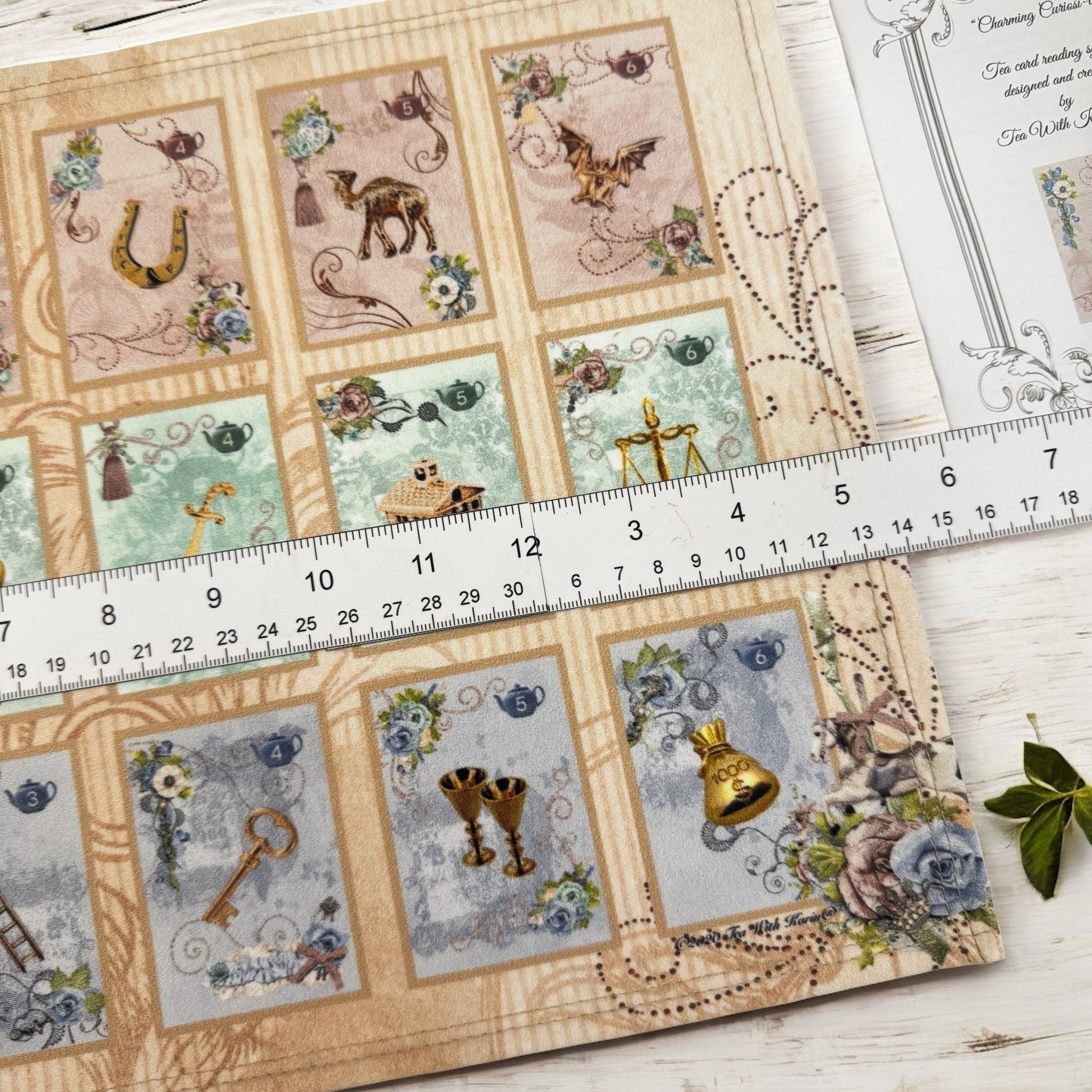 This is a full divination system all in one travel kit tin.  It has washable spandex mat and 18 cards and 18 charms and 3 dice.