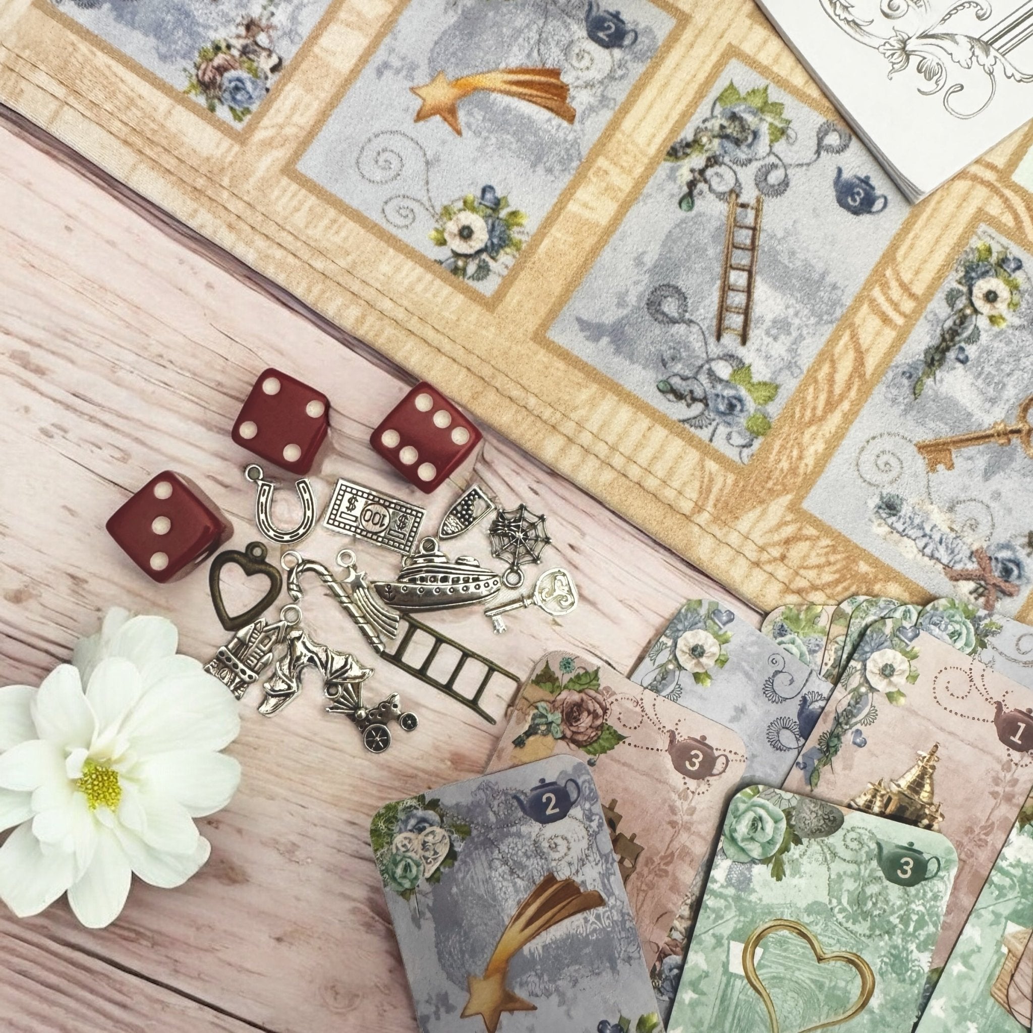 This is a full divination system all in one travel kit tin.  It has washable spandex mat and 18 cards and 18 charms and 3 dice.