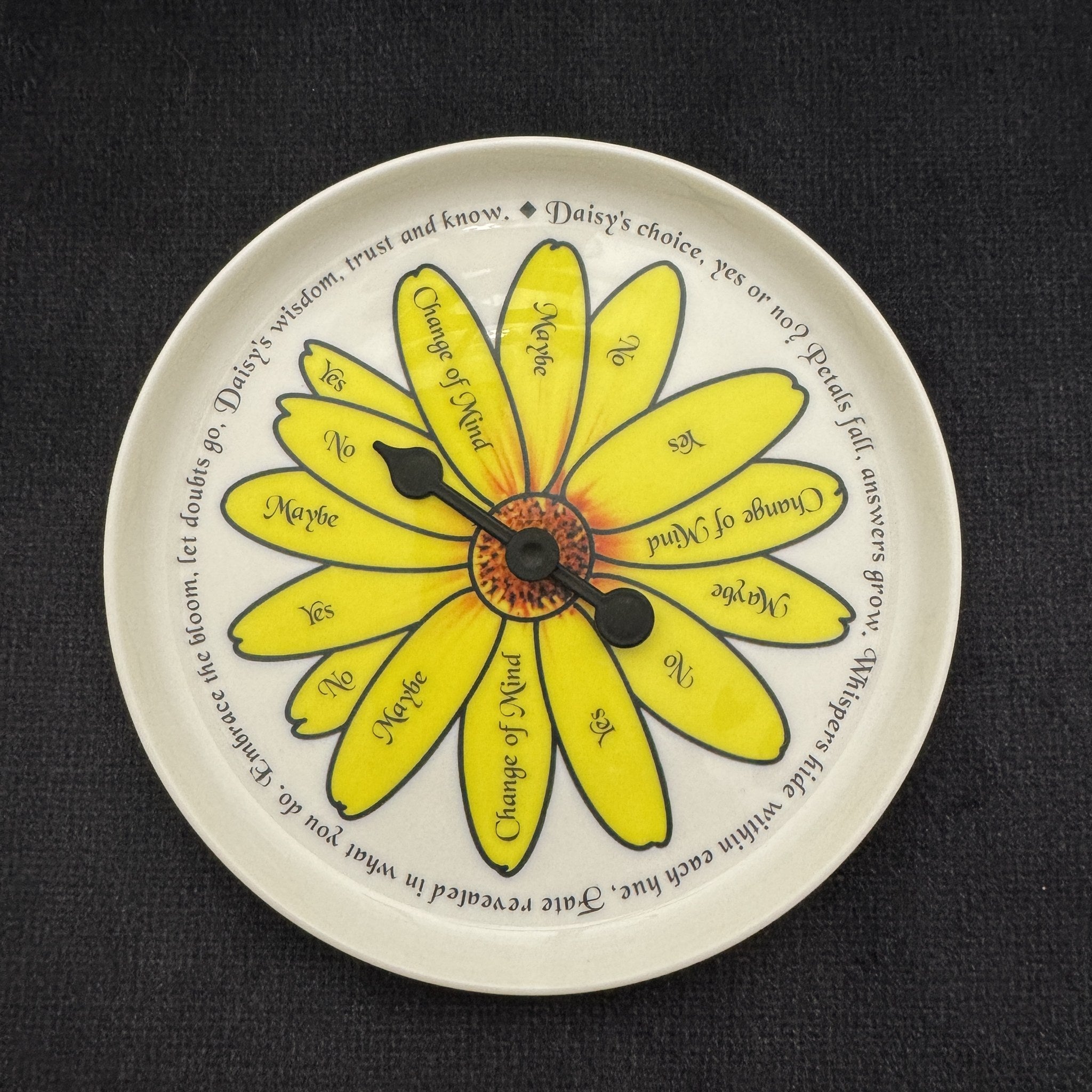 Pick a Daisy yes no maybe spinner plate with yellow daisy petals and black spinner