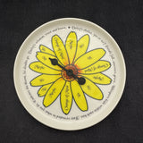 Pick a Daisy yes no maybe spinner plate with yellow daisy petals and black spinner