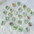 Set of 1-inch tarot buttons featuring the Major Arcana images on a pale mint green background, protected by a clear plastic coating, ideal for tarot, charm casting, and discreet divination in everyday settings