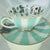Video showcasing the teacup set including the exterior stripes, interior illustrations, and saucer text