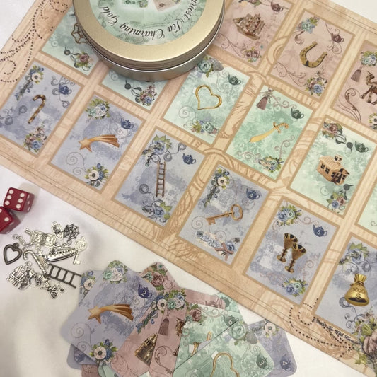 This is a full divination system all in one travel kit tin.  It has washable spandex mat and 18 cards and 18 charms and 3 dice.